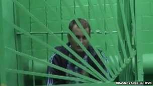 Surgeon in custody in Krasnoyarsk (garb from police video)